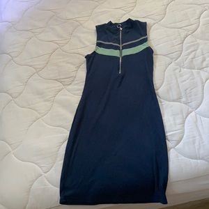 A body hugging thigh length dress